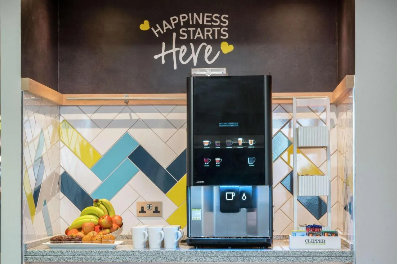 kitchen counter with fruit and a refrigerator at Hampton by Hilton Birmingham Broad Street